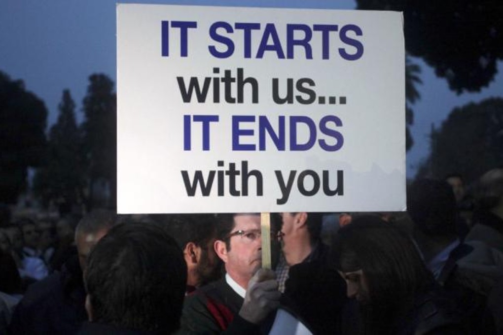 The Cyprus cabinet was meeting in crisis session today to approve a 'Plan B' bailout deal with the EU and IMF, as crowds gathered outside parliament expecting the measure to be put to a vote. Photo: AFP