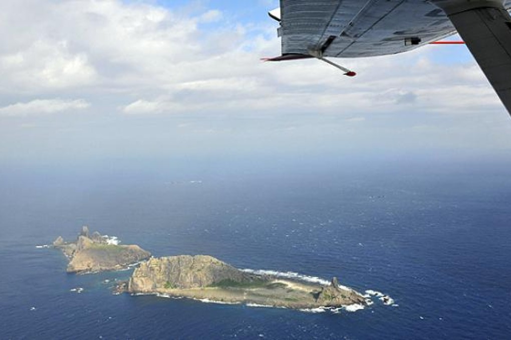 A Chinese surveillance plane flies over the Diaoyu Islands. Photo: Reuters