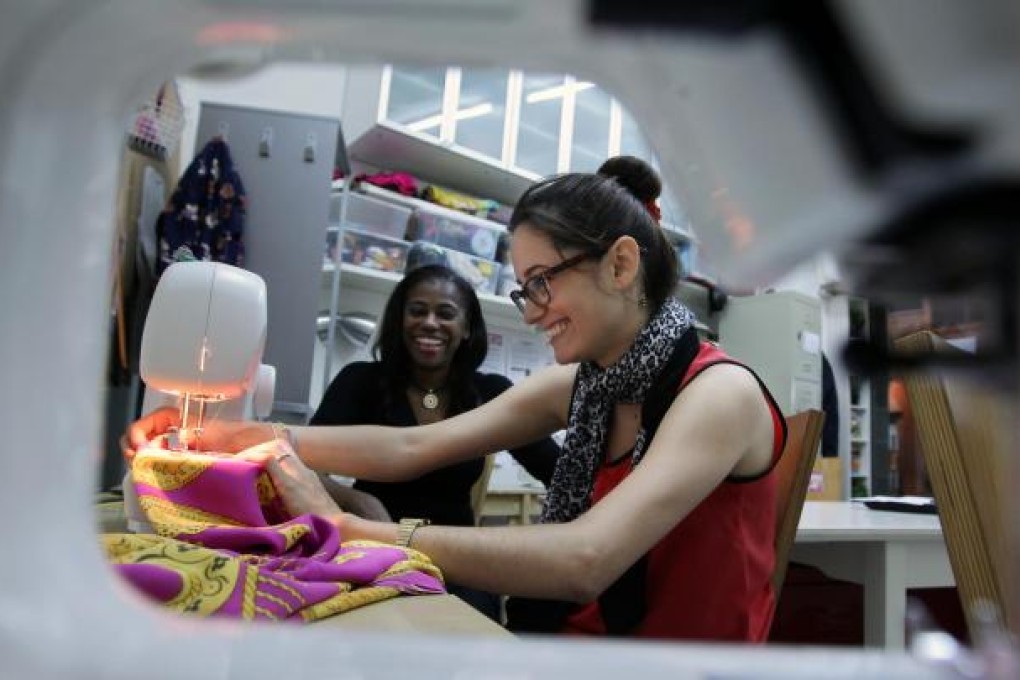 The Sewing Lounge's visual merchandiser Carmen Giraldo (front) and founder Melanie Bell (rear) get down to work. Photo: Jonathan Wong
