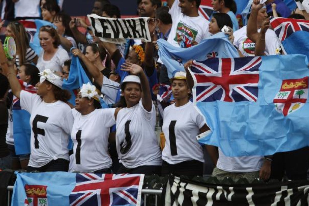 Fiji fans cheer before the start of a preliminary match between Fiji and Hong Kong during the Hong Kong Sevens rugby tournament in Hong Kong. Photo: Reuters