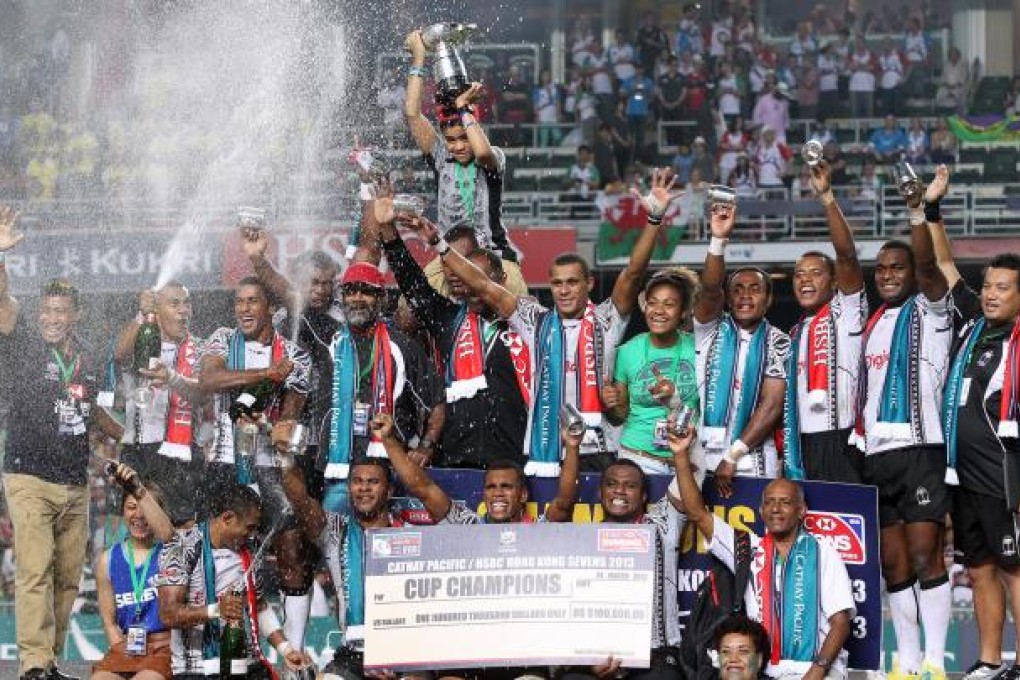Fiji celebrate their 26-19 win over Wales in a final played before a sell-out crowd at the stadium in Causeway Bay. Photo: K.Y.Cheng