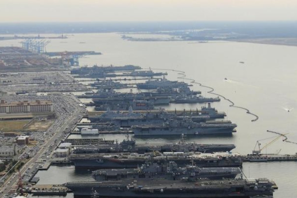 A fleet of US aircraft carriers in a Virginia port. Photo: Reuters