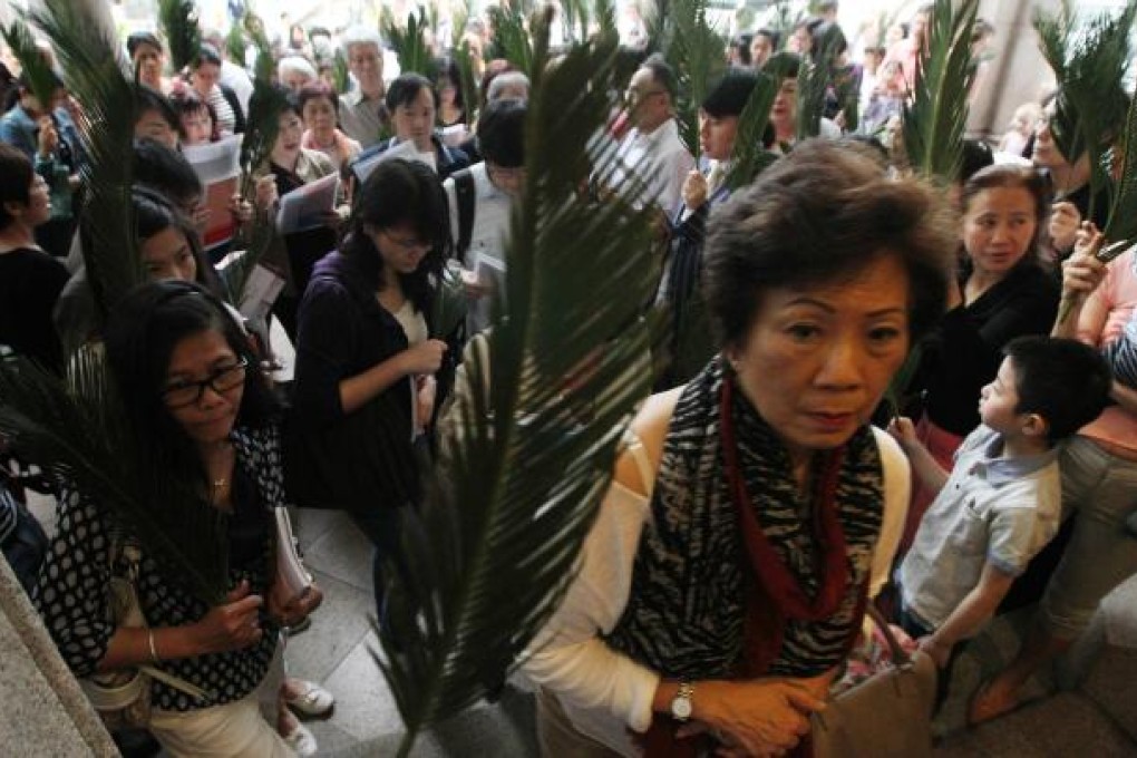 Worshippers at the Cathedral of the Immaculate Conception attend their first Sunday mass after the pope's inauguration. Photo: Felix Wong