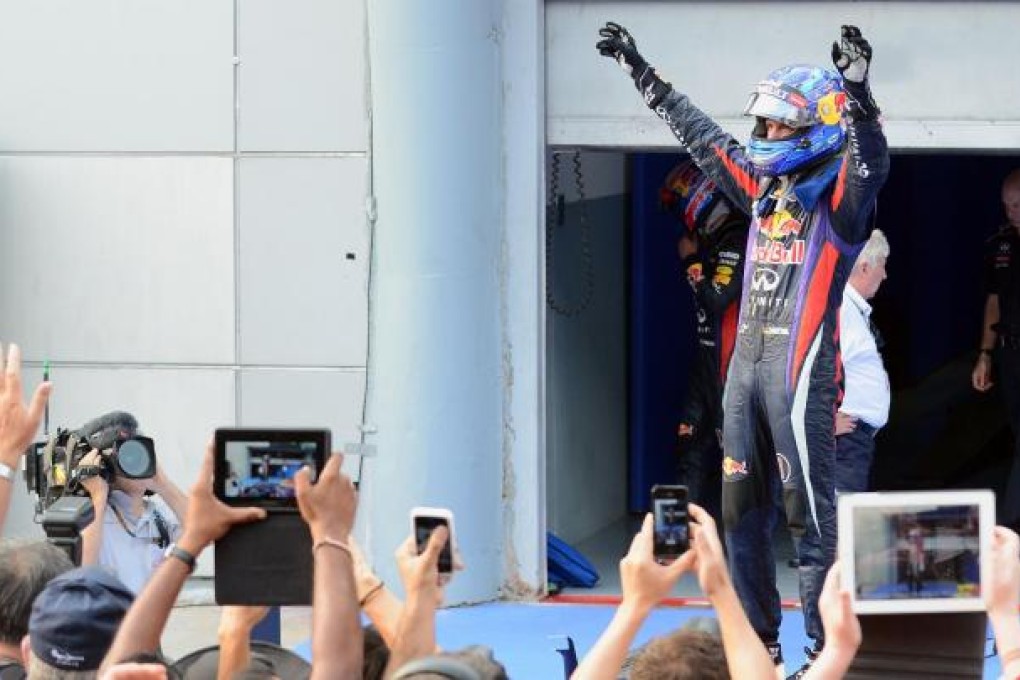 Red Bull's Sebastian Vettel celebrates his victory in the Malaysian Grand Prix at the Sepang circuit yesterday, in a race he admitted should have been won by teammate Mark Webber.Photo: AFP