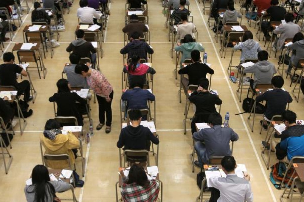 English candidates are put through their paces during the A-level examination in Po Leung Kuk Ngan Po Ling College in To Kwa Wan. Photo: May Tse