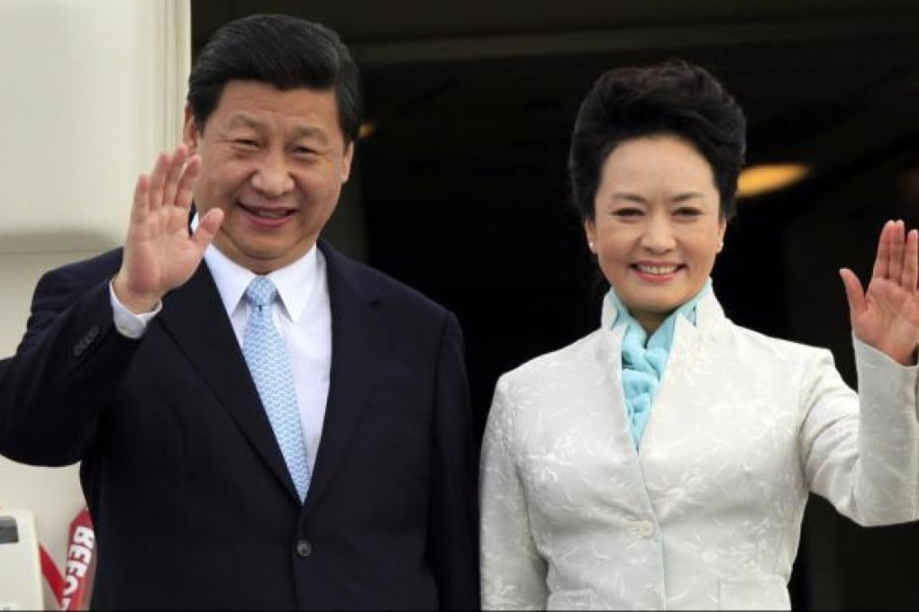 President Xi Jinping and First lady Peng Liyuan wave from their plane on arrival at Dar es Salaam yesterday. The couple arrived in Tanzania from Moscow. Photo: Reuters