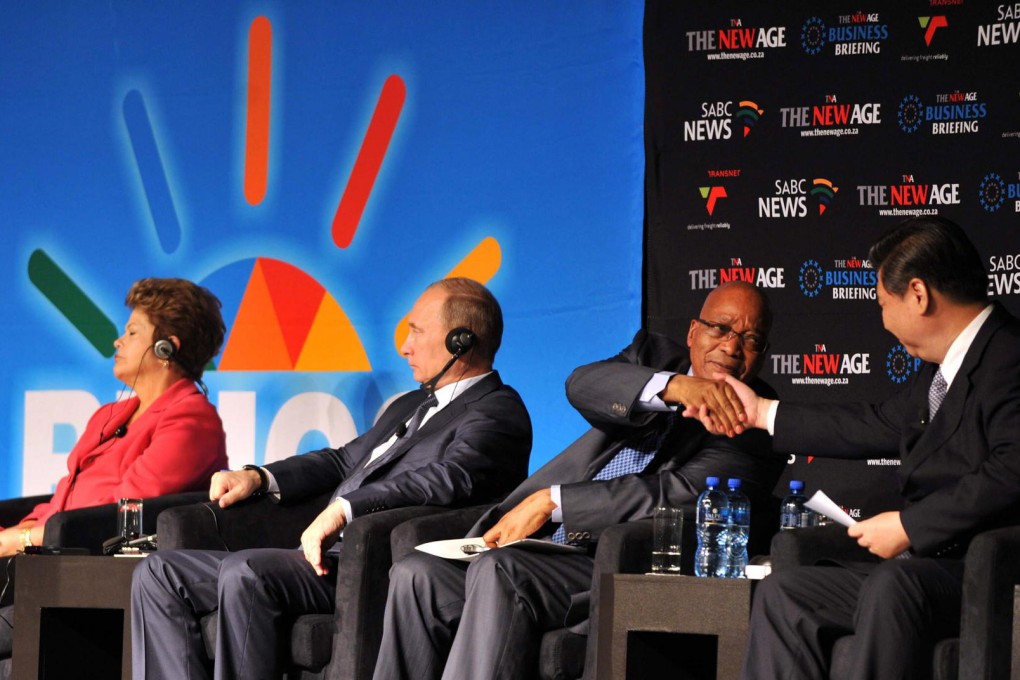 BRICS leaders Dilma Rousseff, of Brazil, Russia's Vladimir Putin, South Africa's Jacob Zuma and Xi Jinping at a summit in Durban. Photo: EPA
