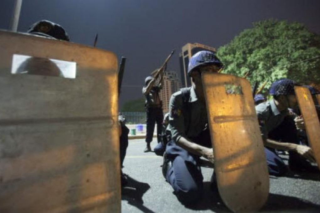 Myanmar policemen in action as they participate in urgent riot control training exercise near the Yangon city hall, Yangon in Myanmar. Photo: EPA