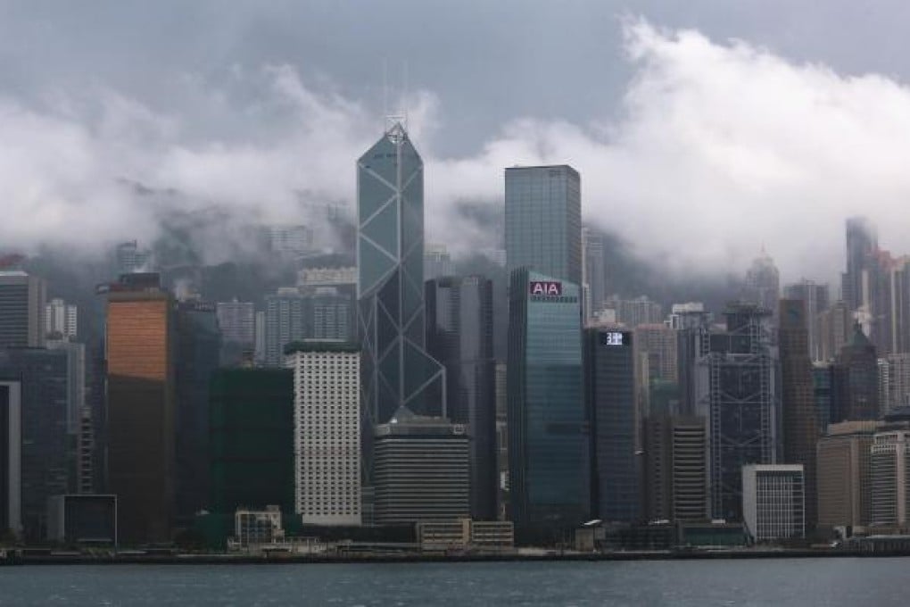Storm clouds over Hong Kong Island yesterday. The government says the city’s air quality must improve within three years. Photo: KY Cheng
