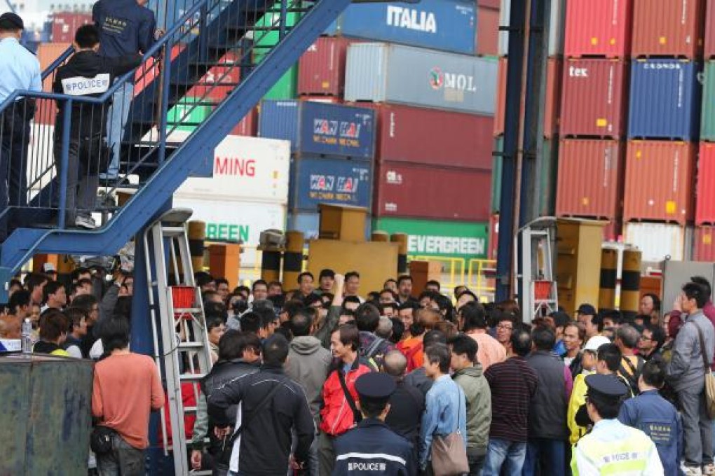 Workers protest over a wage dispute at the Kwai Tsing Container Terminal yesterday. Photo: Sam Tsang