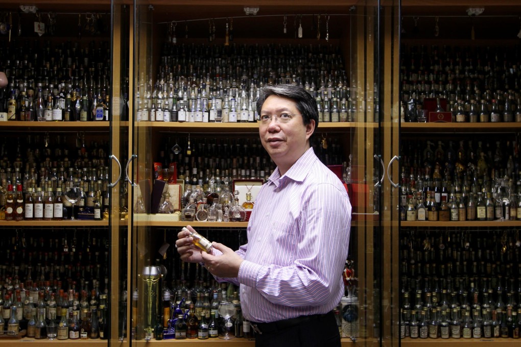 Man's Chan with his miniature bottles. Photo: Jonathan Wong