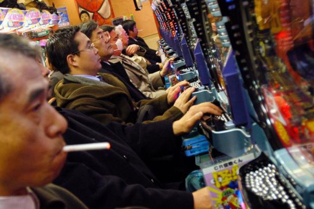 A new law requires the townsfolk in Ono to report welfare receipients who spend money playing pachinko. Photo: Bloomberg