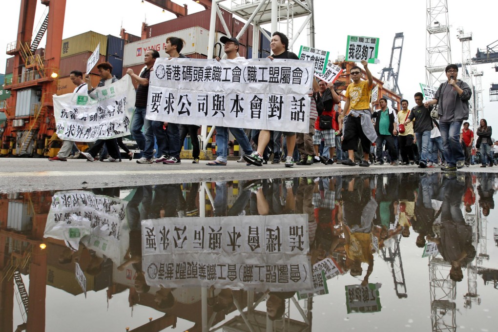 The workers march to the offices of Everbest and Comcheung. The Union of Hong Kong Dockers said the number of striking workers was growing. Photo: Edward Wong