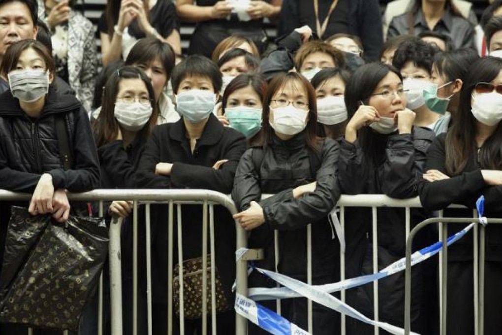 Fans of Leslie Cheung pay their respects at his funeral, on April 8, 2003, after the actor leapt to his death from the 24th floor of the Mandarin Oriental hotel. Photos: AFP; SCMP Pictures; AP; Reuters