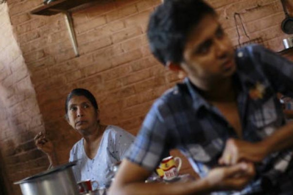 A Muslim family sits in their home in Minhla March 29, 2013. Photo: Reuters