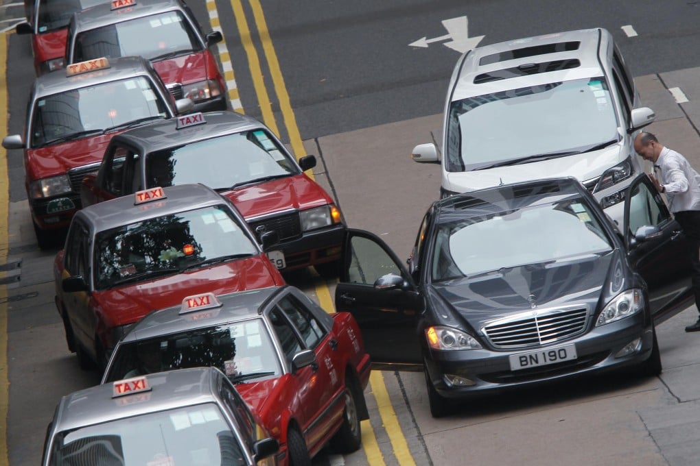 Cars double parked in a street in Central. Photo: David Wong