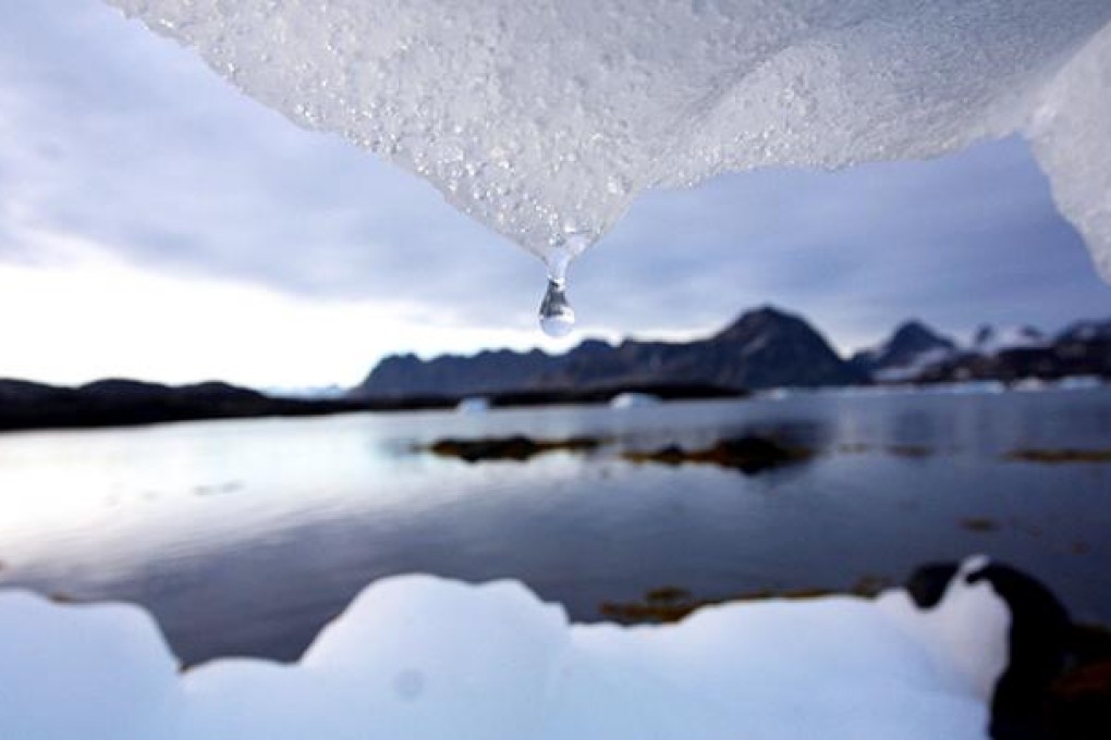 n iceberg melts in Kulusuk, Greenland near the arctic circle