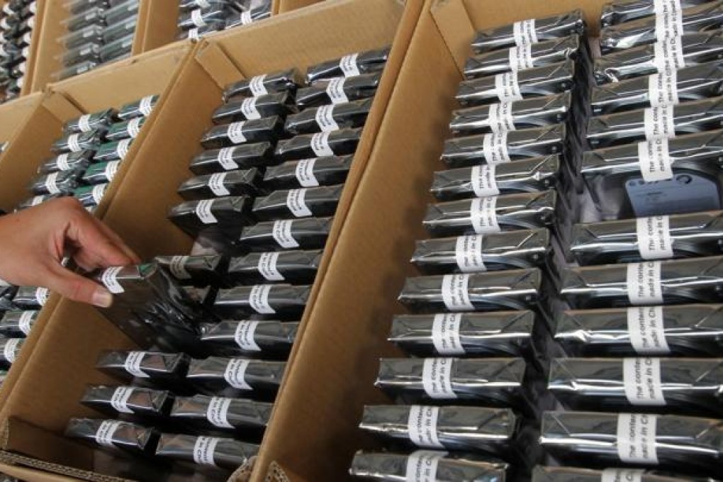 Some of the 29,000 smuggled computer hard disks seized on a mainland cargo ship. Computer hard disks are one of the mainland's star exports. Photo: David Wong