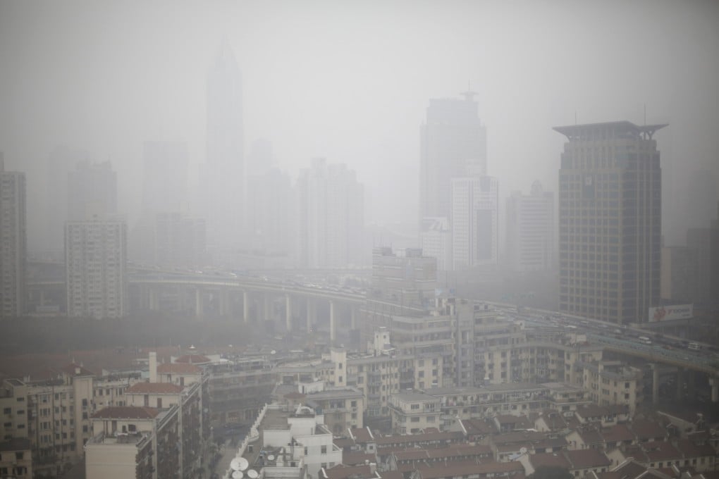 Houses and buildings are seen on a heavy haze in Shanghai, China. Photo: AP