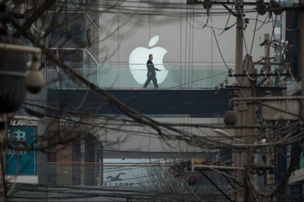 Apple apologises to Chinese customers in row over warranty