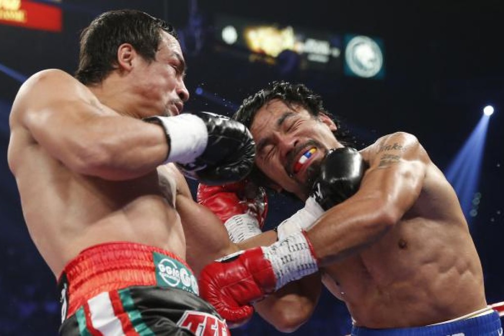 Juan Manuel Marquez and Manny Pacquiao trade blows last year. A rematch is on the cards for September. Photo: AP