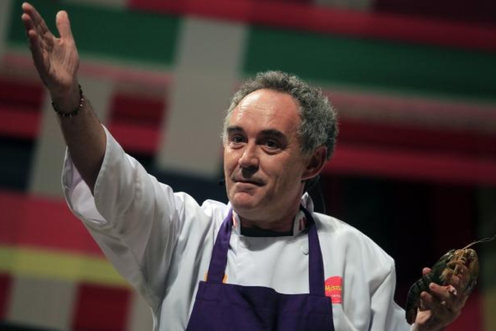 El Bulli restaurant head chef Ferran Adria gestures while holding a shrimp as he speaks during a conference at the "Mistura" gastronomic fair in Lima. Photo: Reuters