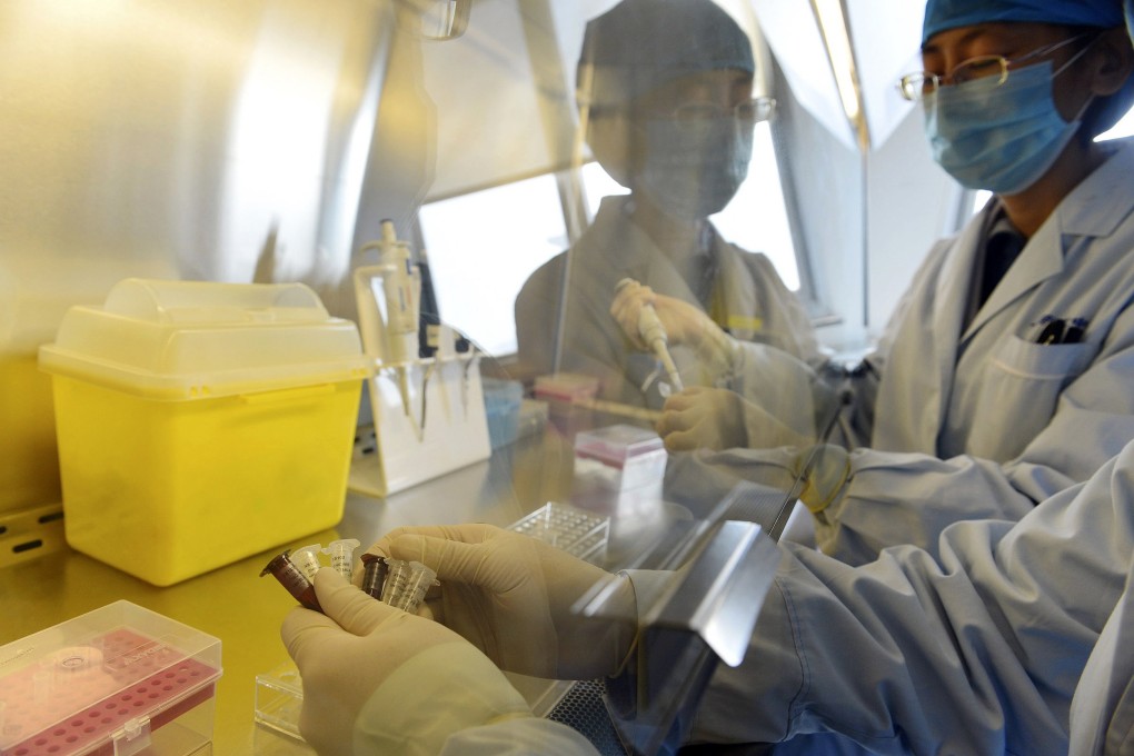 Technicians carry out a test for the H7N9 bird flu virus using test reagents at the Beijing Centre for Diseases Control and Prevention (CDC). Photo: Reuters