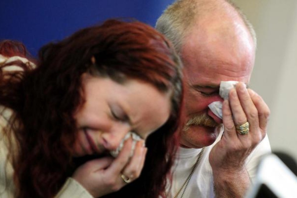 Mick and Mairead Philpott react after the fire. Photo: AP