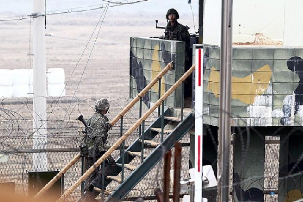 South Korean soldiers stand guard at a sentry post at the border with North Korea. Photo: EPA