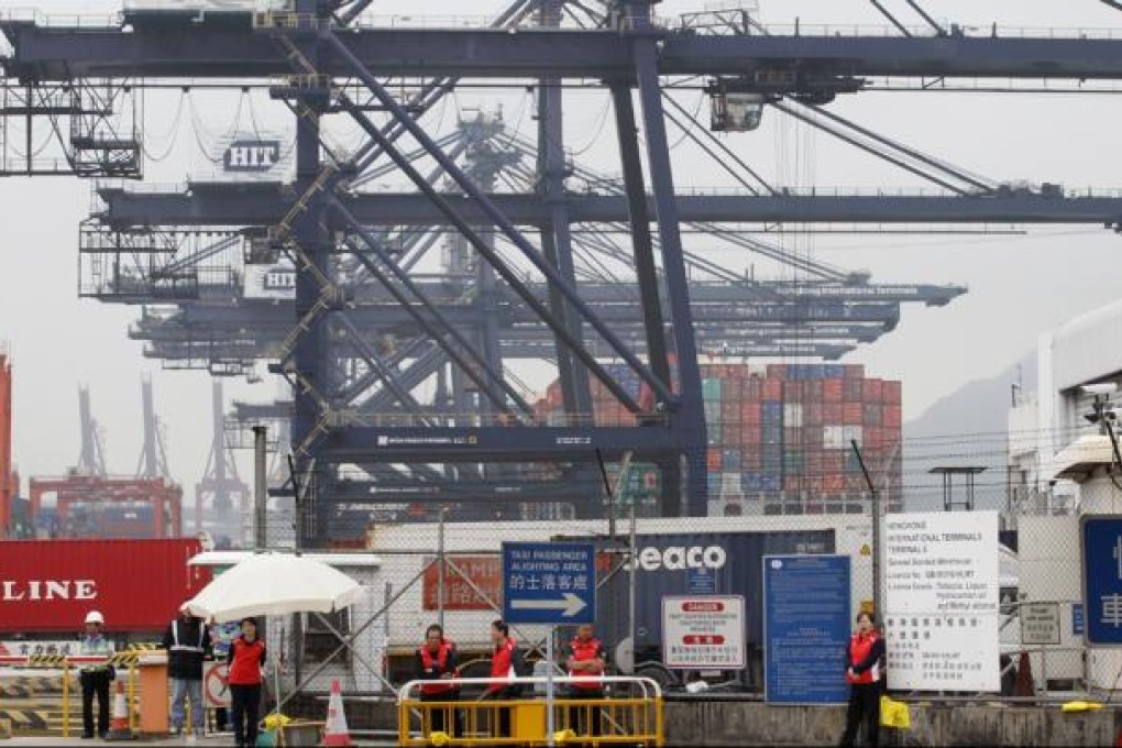 Dock workers occupy a road outside Kwai Chung Container Terminal. Photo: Edward Wong