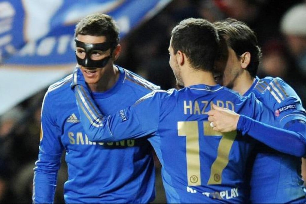 Chelsea striker Fernando Torres celebrates with Eden Hazard and Yossi Benayoun after scoring his second against Rubin Kazan. Photo: EPA