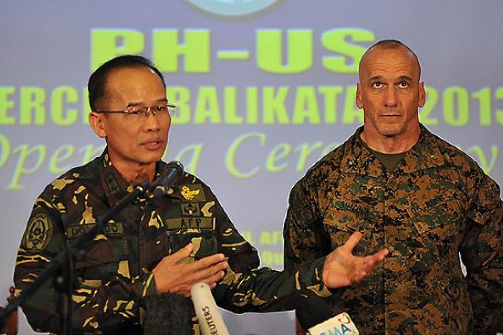 Philippine deputy exercise director Major General Virgilio Domingo (left) speaks while his US counterpart Brigadier General Richard Simcock II listens during their joint press conference at the opening ceremony for annual military exercises at a military camp in Manila. Photo: AFP