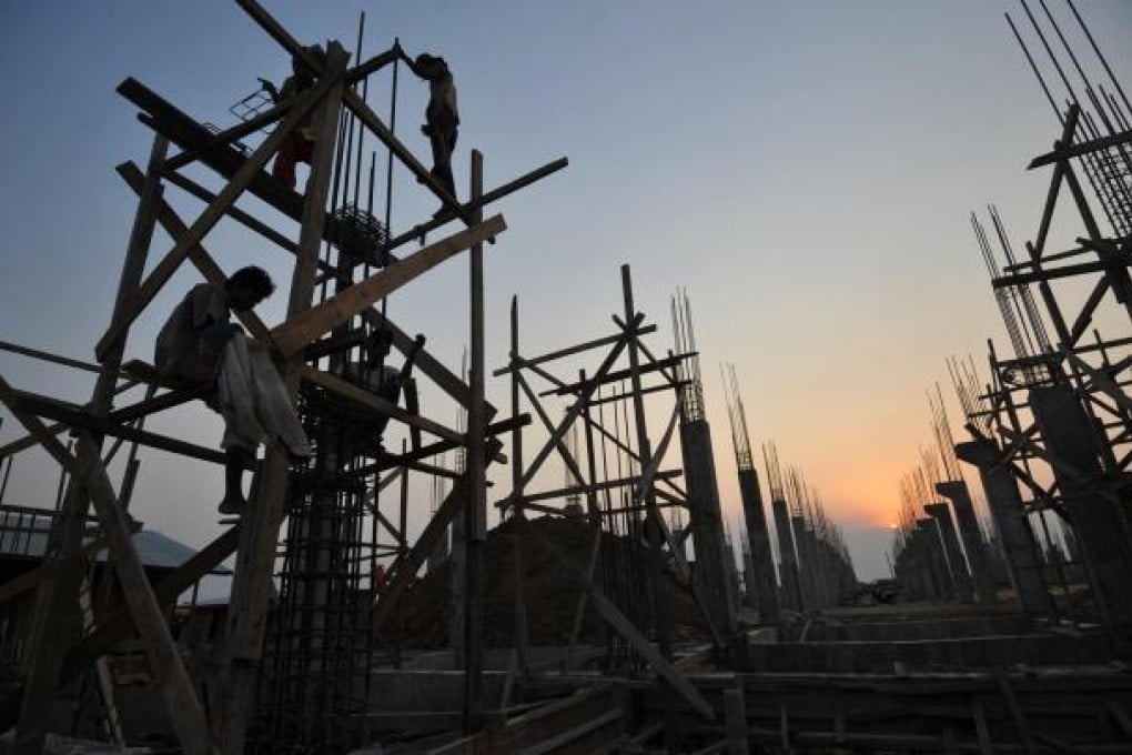Buildings go up in Yangon, where infrastructure is unable to keep up with breakneck development. Photo: AFP