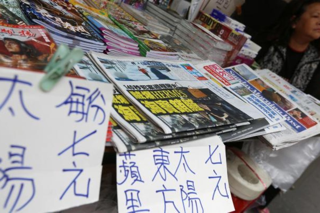 A Wan Chai newsstand informs readers of the price rise.