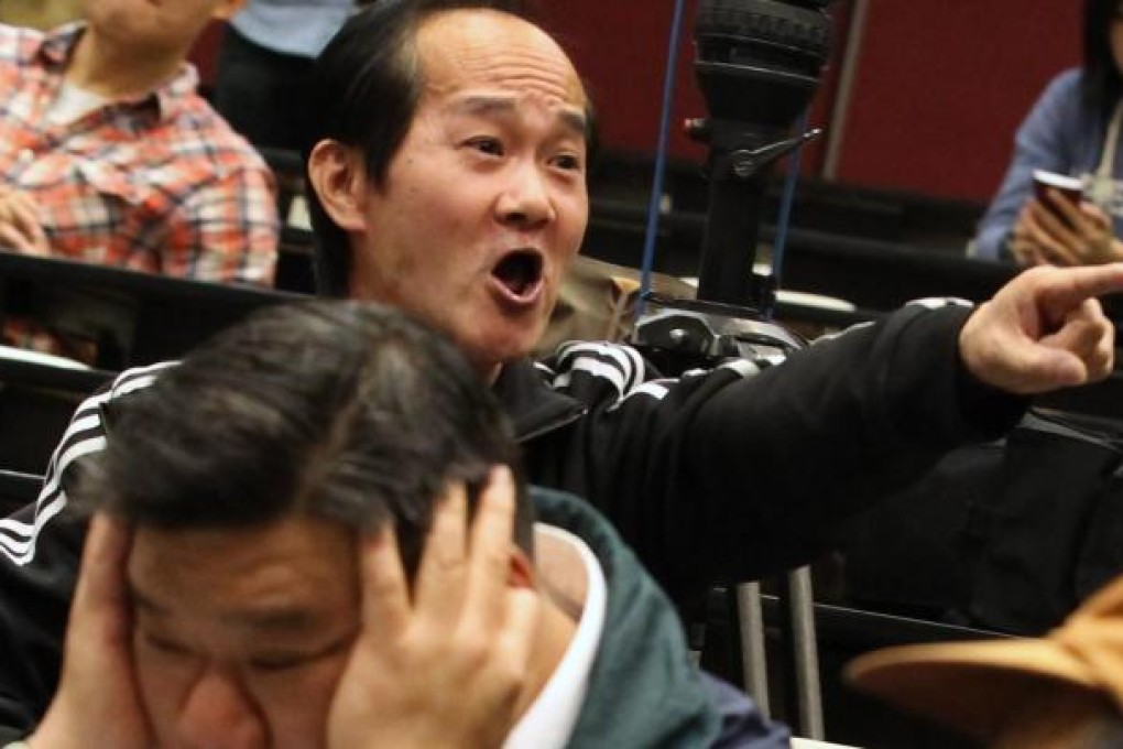 About 30 opponents succeeded in disrupting yesterday's forum on universal suffrage at City University, organised by the Alliance for True Democracy. Photo: Edward Wong