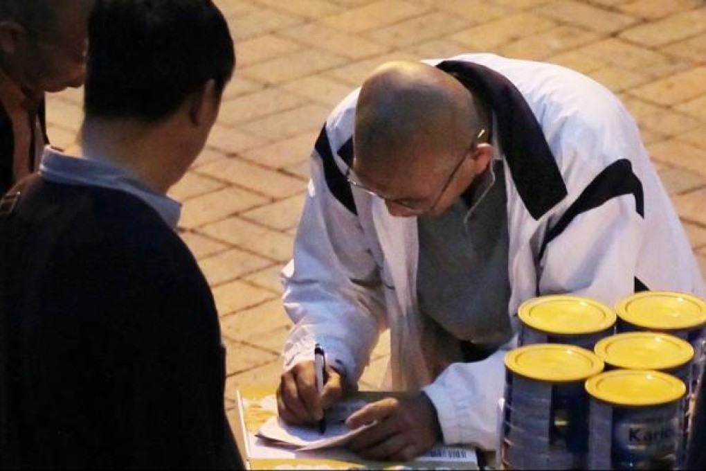 Parallel tradings in infant milk formula are seen operating near Sheung Shui MTR station. Photo: Nora Tam