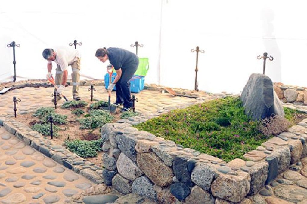 Members of the the Medical Legal Service dig at the tomb of Chilean poet Pablo Neruda in Isla Negra, some 120 km west of Santiago, on Sunday. Photo: AFP