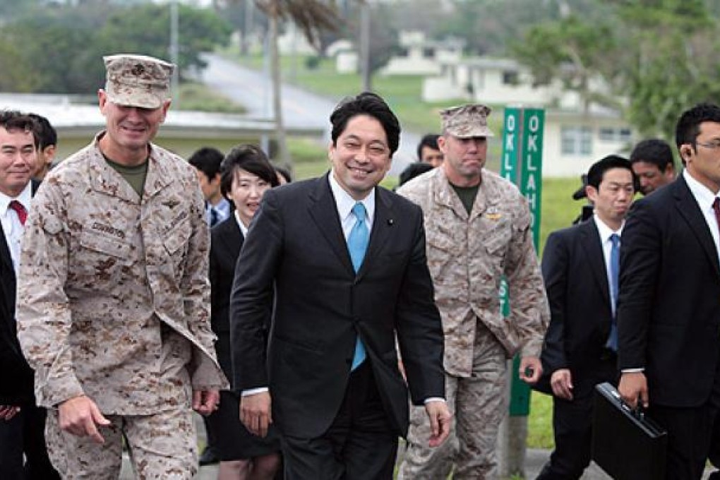 Defence Minister Itsunori Onodera (centre) visits the US Marine Corps in Ginowan, Okinawa, on Saturday. Photo: EPA