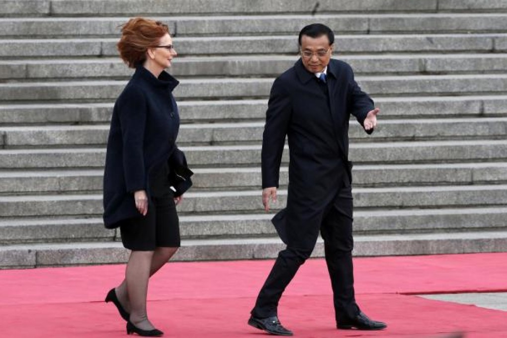 Premier Li Keqiang welcomes Australian Prime Minister Julia Gillard. China has become Australia's largest trading partner. Photo: Reuters