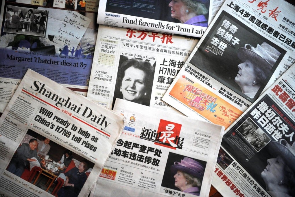 Newspapers available in Shanghai record the death of Margaret Thatcher. Photo: AFP