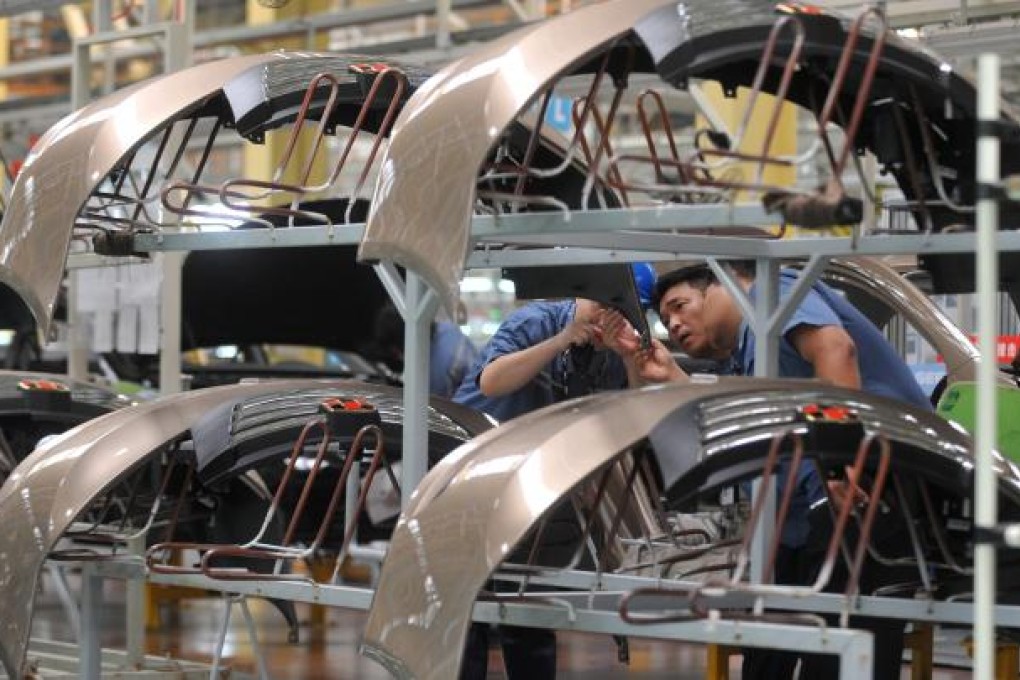 Workers check components at an assembly line at Geely Auto Ningbo factory in Zhejiang Province. Chinese automakers are expected to benefit from a shift to private transport triggered by bird flu. Photo: Xinhua