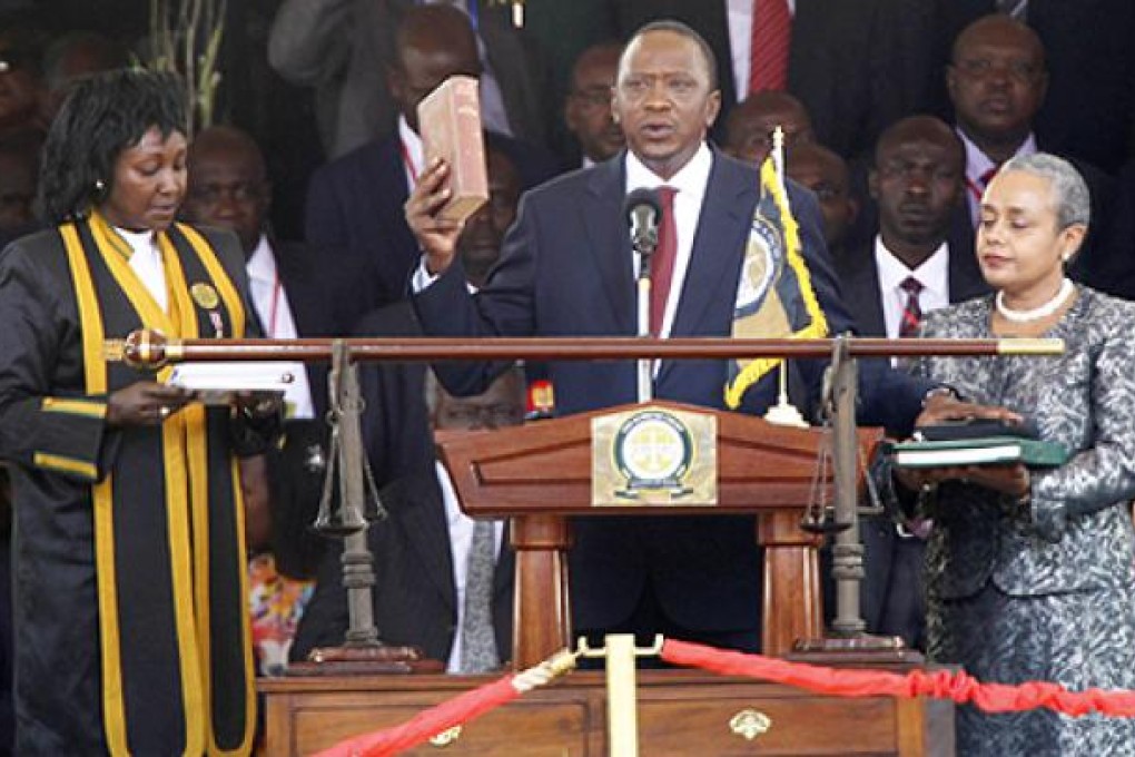 Kenya's President Uhuru Kenyatta takes the oath of office. Photo: Reuters