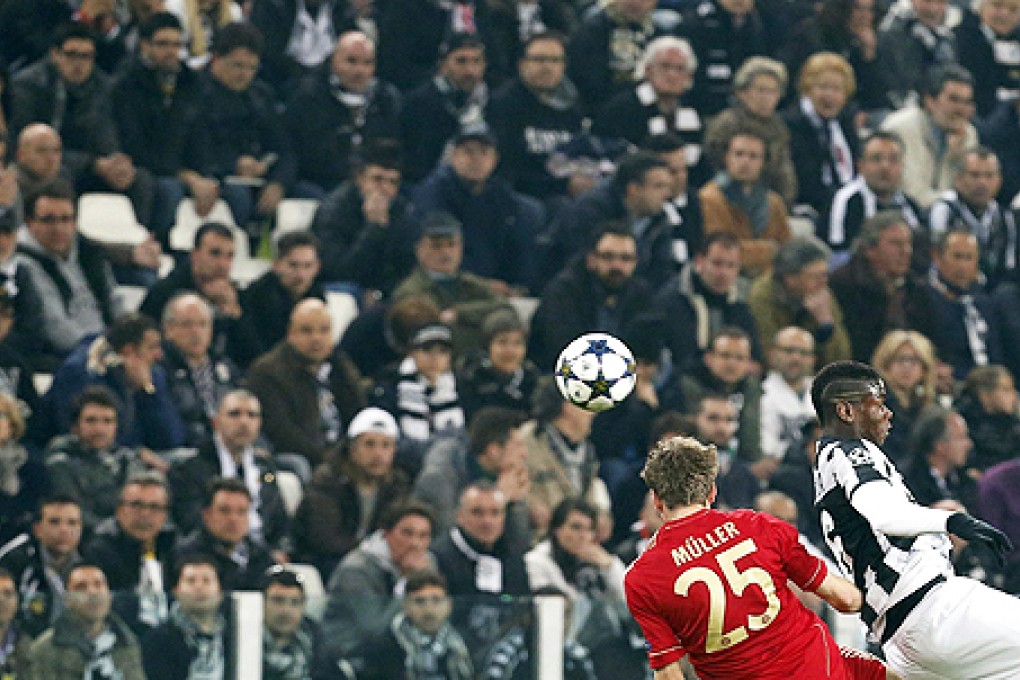 Bayern Munich's Thomas Mueller (left) and Paul Pogba of Juventus fight for the ball on Wednesday. Photo: Reuters