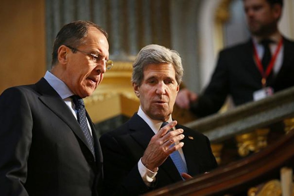US Secretary of State John Kerry, right, talks with Russia's Sergey Lavrov at the G8 Foreign Ministers meeting in London. Photo: AP