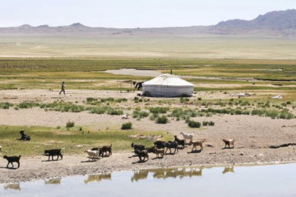 In Mongolia's Gurvansaikhan National Park, the Camel Lodge (left) offers guests luxuries and spa treatments in yurts, which traditionally house Mongolia's nomadic herders (above) in the Gobi Desert. Photo: SCMP pictures