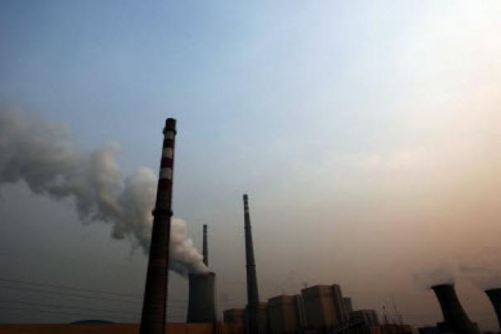 A power plant as the sun sets in Beijing. China is feeling the man-made heat of global warming. Photo: EPA