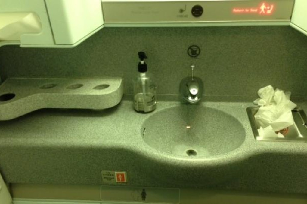 CX831 JFK to Hong Kong - grubby business class toilet.