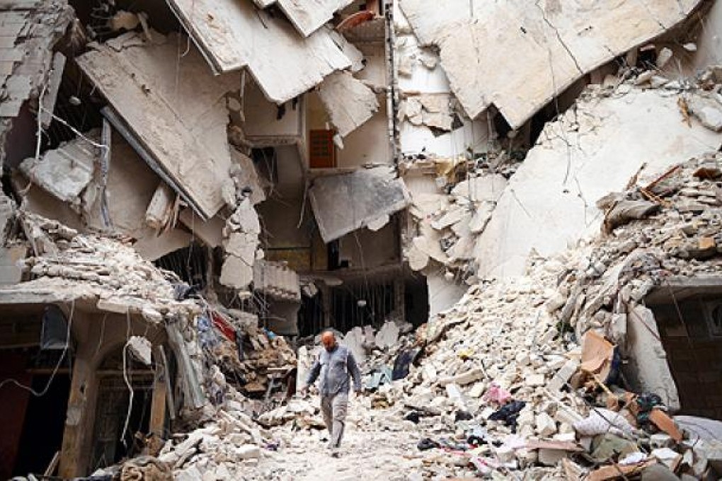 A Syrian man walks amid destruction in the northern Syrian city of Aleppo. Photo: AFP