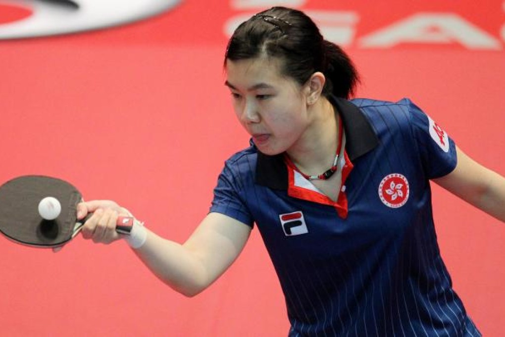Hong Kong's Lee Ho-ching in action in the Asian Cup at the Queen Elizabeth Stadium yesterday. She was beaten 4-1 by China's Wu Yang in her group match. Photo: Felix Wong
