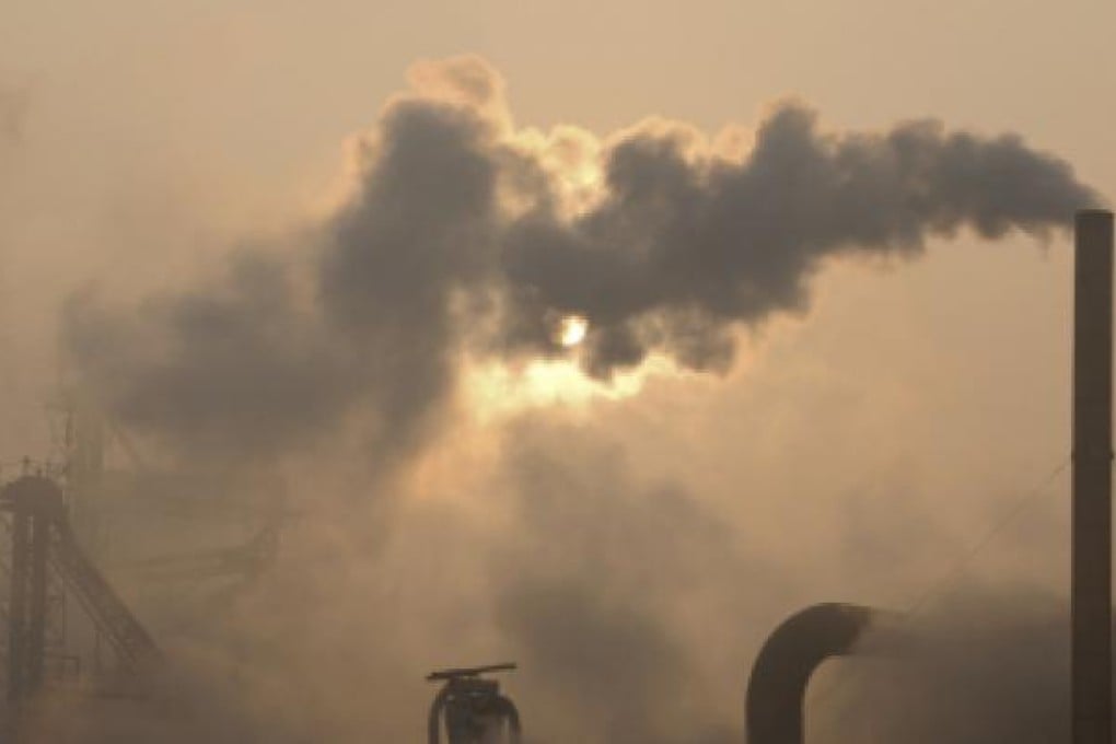 Emissions from chimneys of a cement plant in Binzhou city, in eastern China's Shandong province. The UN says the world's climate change goal at now risk because emissions are surging, says the UN. Photo: AP